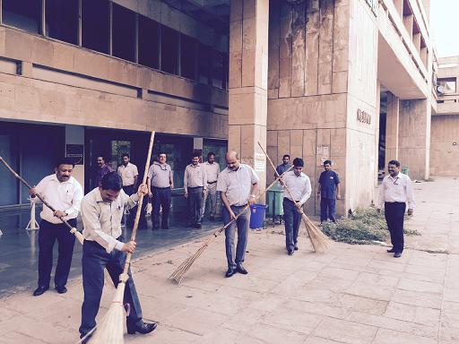 NEEPCO New Delhi officials seen taking up cleanliness drive in front of NBCC Tower at Bhikaji Cama Place on the occasion of World Environment Day